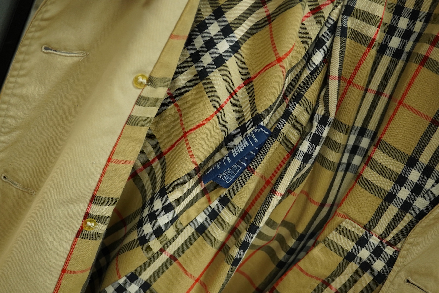 A ladies Burberry mac with check lining and belt, size 16 Long